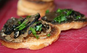 Caviar and black truffle pairing on bruschetta